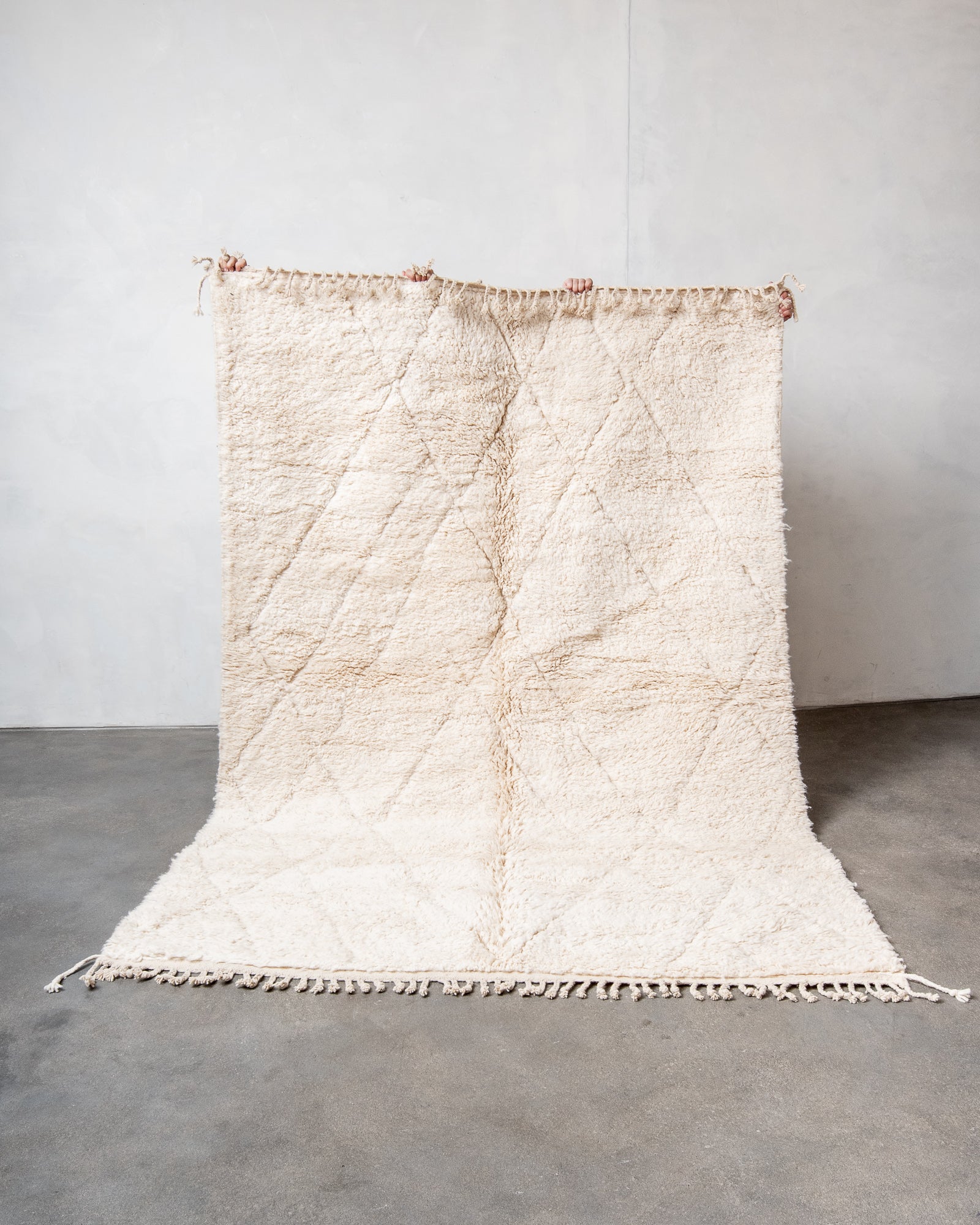 Modern, designer, handcrafted Berber rug from Morocco. Beniourain carpet with beautiful colours and patterns and fluffy wool texture.